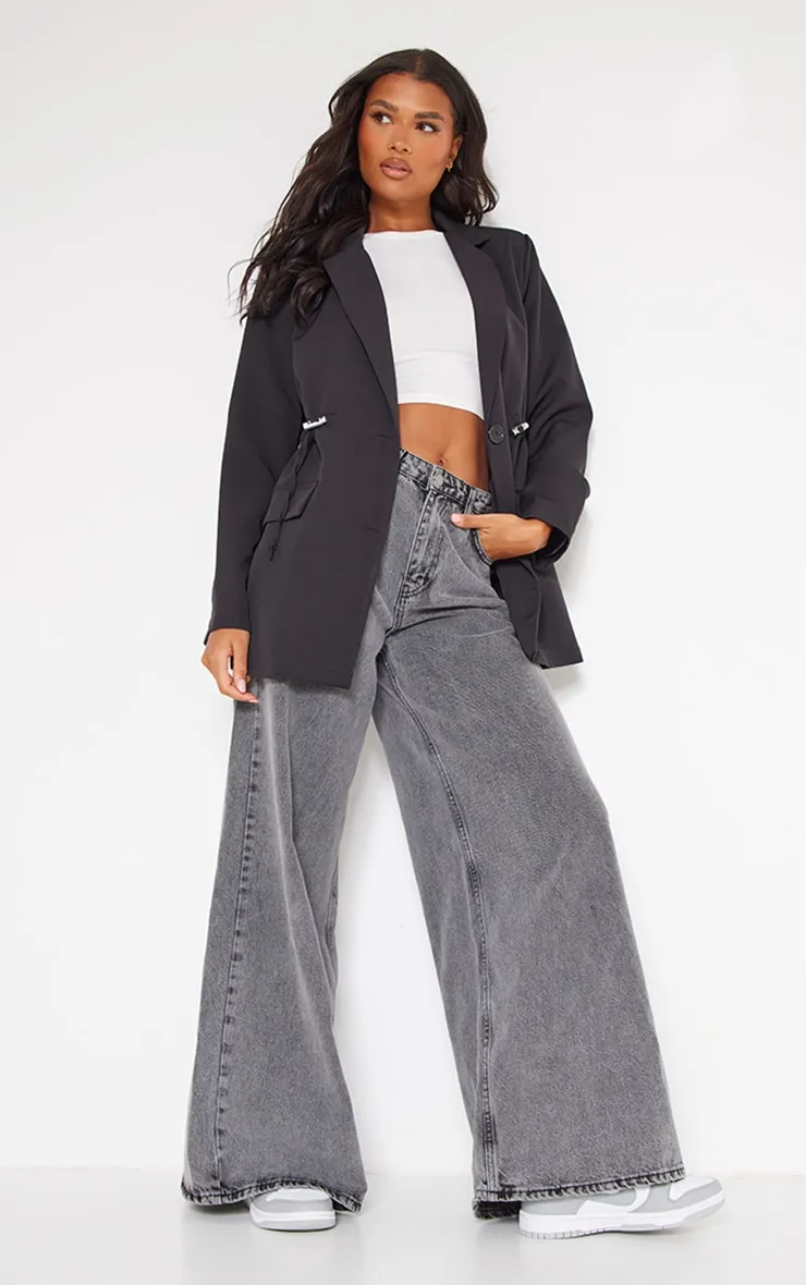 Blazer noir à cordons ajustables sur la taille