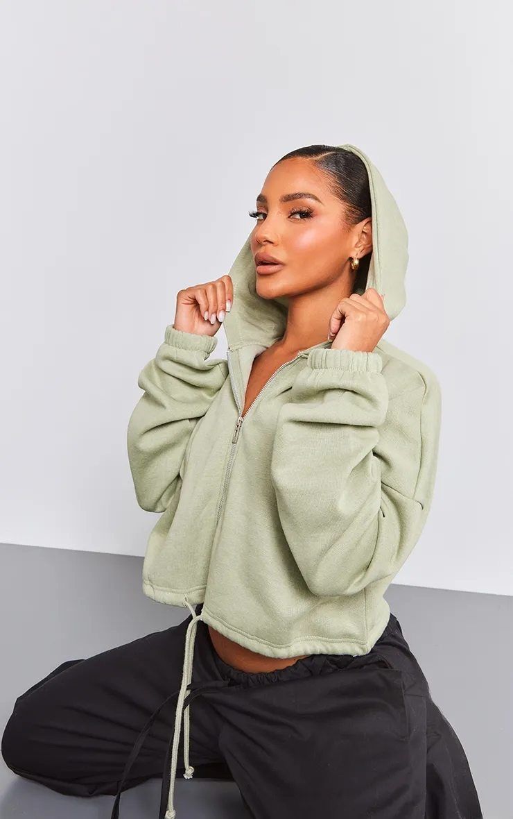 Hoodie court vert sauge à zip et cordons ajustables