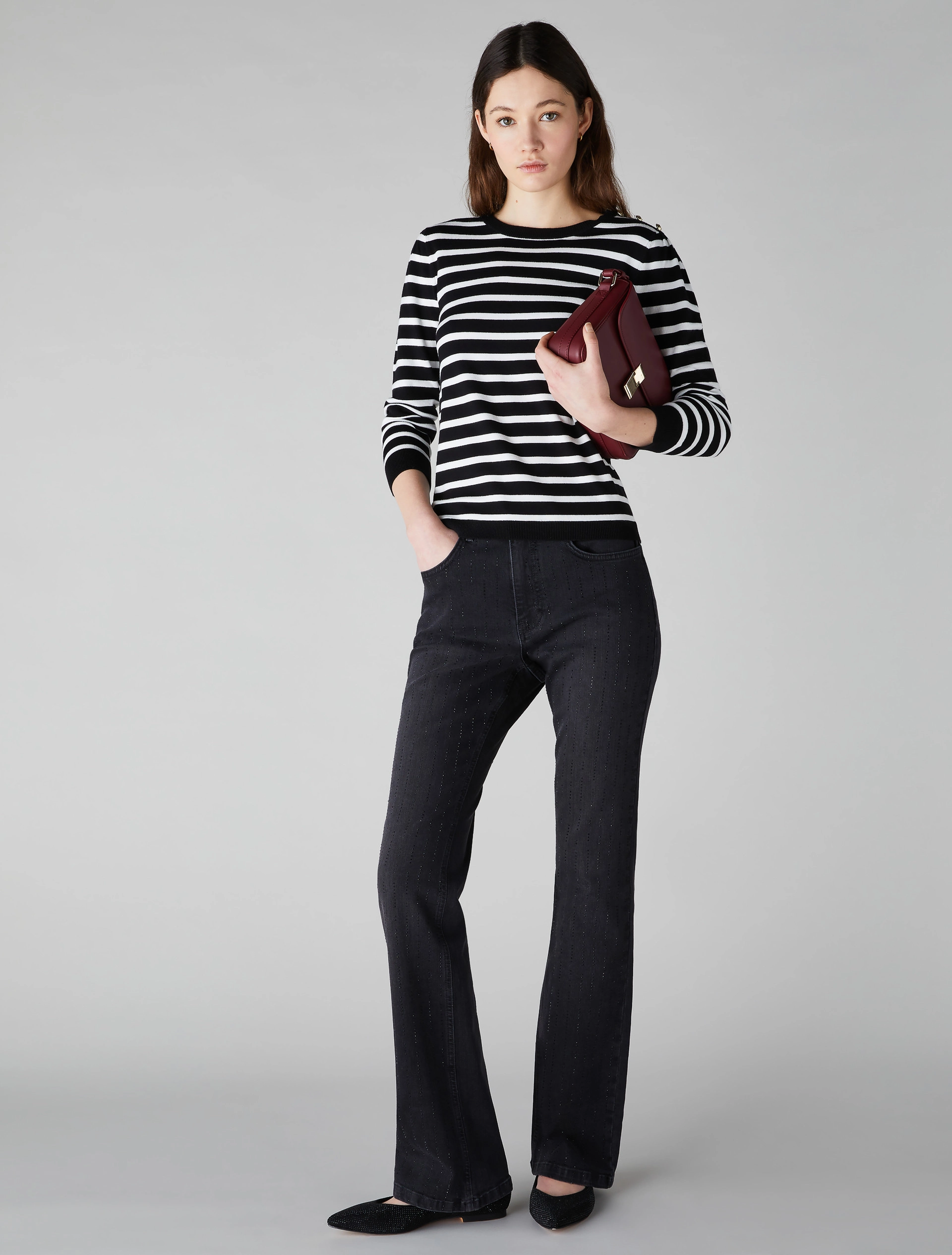 Pull avec boutons dorés